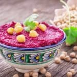 Beetroot hummus is a delicious and healthy dip made from cooked beets, chickpeas, tahini, olive oil, garlic, lemon, and spices.