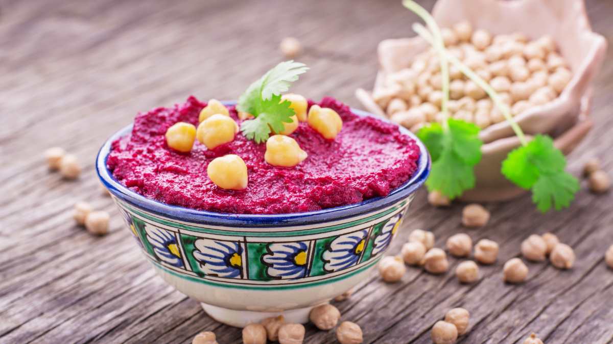Beetroot hummus is a delicious and healthy dip made from cooked beets, chickpeas, tahini, olive oil, garlic, lemon, and spices.